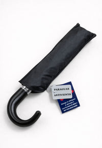 Paraguas plegable negro con mango de piel anti viento
