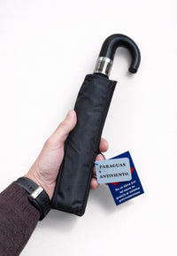 Paraguas plegable negro con mango de piel anti viento