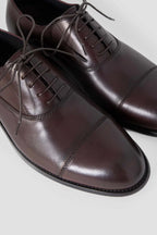 Zapatos Oxford de piel en color burdeos